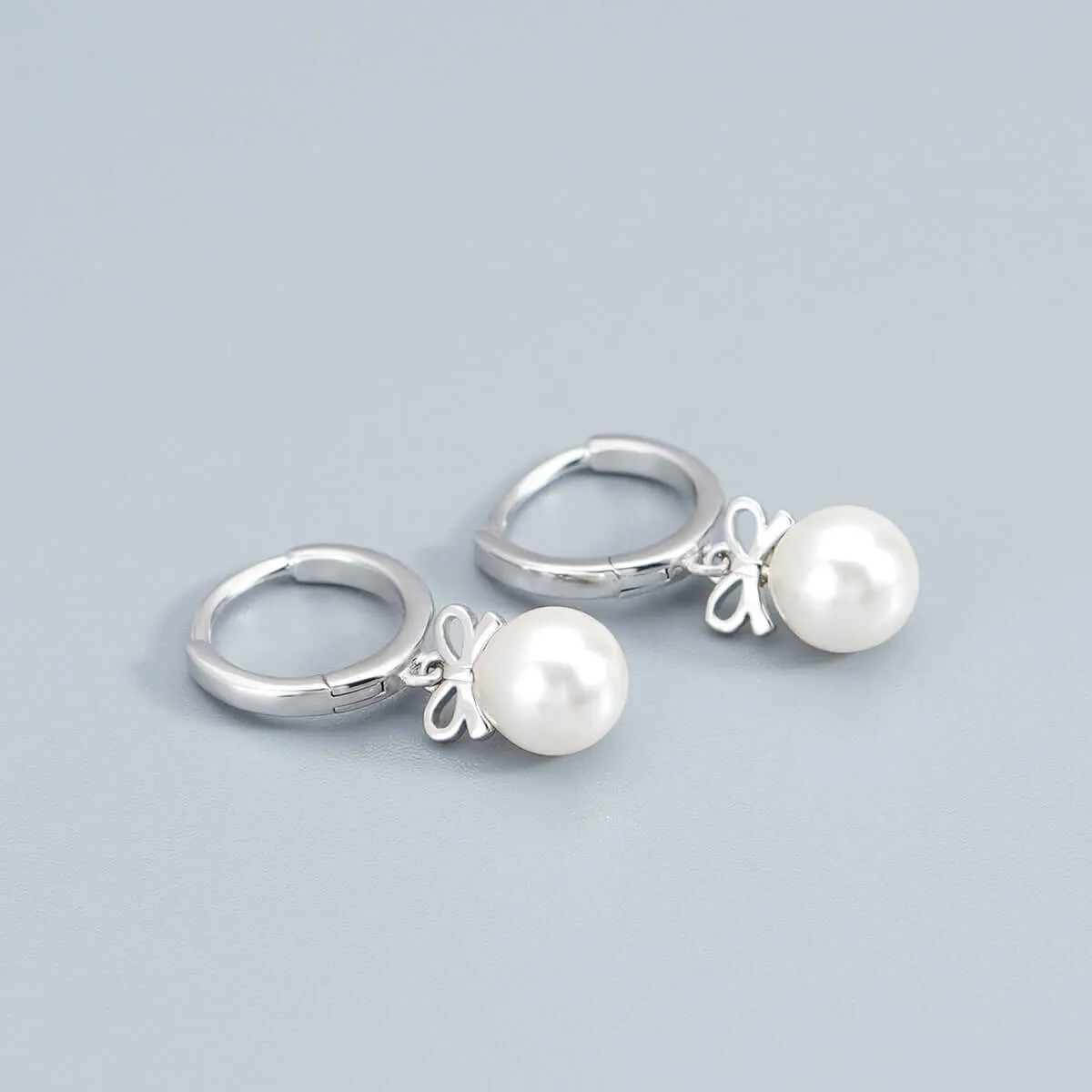 925 Silver Bow Pearl Huggie Earrings