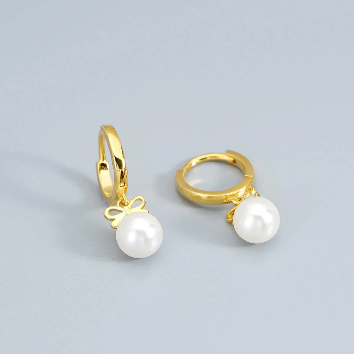 925 Silver Bow Pearl Huggie Earrings